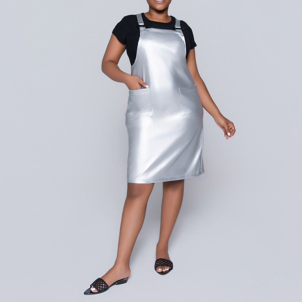 silver pinafore dress Gianfranco Ferre Milan Ready to Wear Spring Summer Bun hair, sleeveless silver pinafore dress structured side pockets and t bar Stock Photo